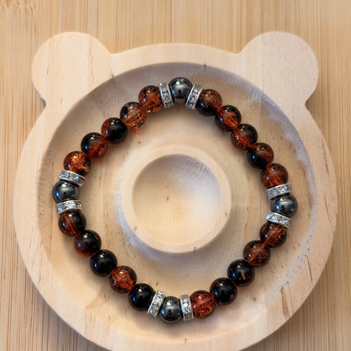 Amber Ember bracelet with black and amber-toned round beads and silver-tone spacers